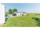 Large backyard with detached garage, shed, and a lush green lawn at 272 Jefferson St, Columbus, IN 47201
