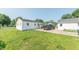 Spacious backyard features a detached garage and a well-maintained lawn at 272 Jefferson St, Columbus, IN 47201