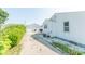 View of the back of the home with a detached garage and a well-maintained yard at 272 Jefferson St, Columbus, IN 47201