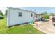 The backyard has a play area and a covered patio, great for outdoor enjoyment at 272 Jefferson St, Columbus, IN 47201