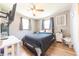 Cozy bedroom with natural light, a comfortable bed, and a ceiling fan at 272 Jefferson St, Columbus, IN 47201