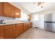 Modern kitchen with stainless steel appliances, ample cabinet space and vinyl floors at 272 Jefferson St, Columbus, IN 47201