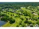 Community view including a golf course, pond, lush greenery and homes; a picturesque and recreational view at 2805 Fox E Ct, Martinsville, IN 46151