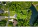 Aerial view of wooded lot featuring mature trees with a lake on property at 2805 Fox E Ct, Martinsville, IN 46151