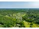 Stunning aerial view of the golf course community surrounded by dense trees and lush landscapes at 2805 Fox E Ct, Martinsville, IN 46151