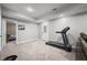 Basement with neutral walls, exercise equipment, and doorway view into an adjacent bedroom at 2805 Fox E Ct, Martinsville, IN 46151
