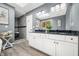 Well-lit bathroom featuring dual sinks, vanity, and a separate tiled shower for convenience and style at 2805 Fox E Ct, Martinsville, IN 46151