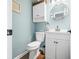 Well-lit bathroom featuring blue walls, a mirror, and white vanity at 2805 Fox E Ct, Martinsville, IN 46151