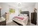 Cozy bedroom featuring a comfortable bed, neutral walls, and natural light from the windows at 2805 Fox E Ct, Martinsville, IN 46151