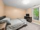 Well-lit bedroom featuring a bed, window with natural light, and a mounted television at 2805 Fox E Ct, Martinsville, IN 46151