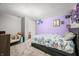 Bright bedroom with a colorful wall and floral bedding, creating a cozy atmosphere at 2805 Fox E Ct, Martinsville, IN 46151