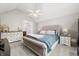 Cozy bedroom with plush carpet, neutral walls, and large bed, creating a relaxing retreat at 2805 Fox E Ct, Martinsville, IN 46151