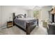 Spacious bedroom showcasing a dark wood bed frame and ample natural light at 2805 Fox E Ct, Martinsville, IN 46151