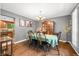 Formal dining room featuring hardwood floors, a dining table with seating, and a decorative hutch at 2805 Fox E Ct, Martinsville, IN 46151