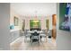 Bright dining area with a round table set, natural light, and views of the outdoors at 2805 Fox E Ct, Martinsville, IN 46151