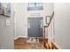 Inviting foyer featuring hardwood floors, staircase and neutral paint throughout at 2805 Fox E Ct, Martinsville, IN 46151
