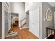 Inviting foyer with wood floors, soaring ceilings, and staircase creates a grand entrance at 2805 Fox E Ct, Martinsville, IN 46151