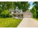 Charming two-story home with brick accents, well-manicured lawn, and a spacious driveway at 2805 Fox E Ct, Martinsville, IN 46151
