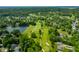 Golf course with a pond surrounded by lush greenery and trees; a scenic and relaxing view at 2805 Fox E Ct, Martinsville, IN 46151