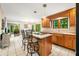 Bright kitchen with granite countertops, center island with seating, and stainless steel appliances at 2805 Fox E Ct, Martinsville, IN 46151