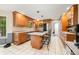 Well-lit kitchen featuring granite countertops, an island with bar seating and stainless steel appliances at 2805 Fox E Ct, Martinsville, IN 46151