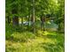 Picturesque view of a tranquil lake framed by trees and lush vegetation, showcasing a serene setting at 2805 Fox E Ct, Martinsville, IN 46151