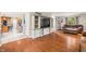 Open concept living room featuring hardwood floors, tv, and access to kitchen at 2805 Fox E Ct, Martinsville, IN 46151