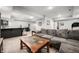 Spacious basement living room with a sectional couch, bar area, and stylish decor at 2805 Fox E Ct, Martinsville, IN 46151