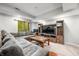 Basement living room with sectional couch, entertainment center, and large windows offering natural light at 2805 Fox E Ct, Martinsville, IN 46151