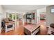Open concept living room featuring hardwood floors, fireplace, tv and natural lighting at 2805 Fox E Ct, Martinsville, IN 46151