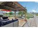 Relaxing backyard patio with gazebo, outdoor furniture, and a well-maintained lawn at 2887 Ludwig Dr, Indianapolis, IN 46239