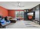 Spacious bonus room featuring comfortable seating, a ceiling fan, and entertainment center with a TV at 2887 Ludwig Dr, Indianapolis, IN 46239