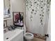 Bright bathroom with updated sink, vanity, and toilet complimented by nature themed décor at 29 Home Ave, Markleville, IN 46056