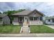 Charming home with a welcoming front porch and well-maintained lawn, featuring beautiful landscaping and a cozy entrance at 29 Home Ave, Markleville, IN 46056