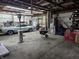 View of a large garage space with classic car and ample storage space for a variety of tools and equipment at 29 Home Ave, Markleville, IN 46056