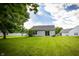 Expansive backyard featuring a well-manicured lawn and the rear of the home at 2905 Inverrary Ct, Indianapolis, IN 46234