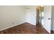 Bright bedroom featuring wood floors, a closet, and a doorway leading to another room at 2905 Inverrary Ct, Indianapolis, IN 46234