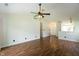Open living area with wood floors, a ceiling fan, and views into other rooms at 2905 Inverrary Ct, Indianapolis, IN 46234