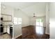 Bright open concept featuring an eat-in kitchen and a large living area with hardwood floors at 2905 Inverrary Ct, Indianapolis, IN 46234