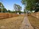 Fenced in backyard with stone paver path at 31 Mckenzie St, Shelbyville, IN 46176