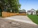 Fenced in backyard area with gravel and concrete at 31 Mckenzie St, Shelbyville, IN 46176