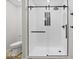 Bathroom features a stand up shower with glass doors and a white toilet at 31 Mckenzie St, Shelbyville, IN 46176