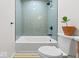Bathroom featuring a bathtub with tile surround and modern black fixtures at 31 Mckenzie St, Shelbyville, IN 46176