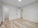 Bright bedroom with light wood floors, neutral walls, and closet storage at 31 Mckenzie St, Shelbyville, IN 46176