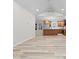Bright and open living room with hardwood floors, a fireplace, and a kitchen in the background at 31 Mckenzie St, Shelbyville, IN 46176