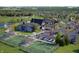 Aerial view of community center with pool, tennis courts, clubhouse and ample parking at 3142 Balsamroot Rd, Greenwood, IN 46143