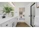 Bathroom with double sinks, modern faucets, plenty of daylight, and an open view of the main bedroom at 3142 Balsamroot Rd, Greenwood, IN 46143