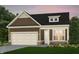 Charming single-Gathering home featuring stone accents, a two-car garage, and a beautifully landscaped front yard at 3142 Balsamroot Rd, Greenwood, IN 46143