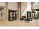 Spacious lobby with a high ceiling, fireplace, comfortable seating, and elegant decor at 3142 Balsamroot Rd, Greenwood, IN 46143