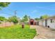 Fenced backyard with patio, shed, and green space at 3242 Welch Dr, Indianapolis, IN 46224